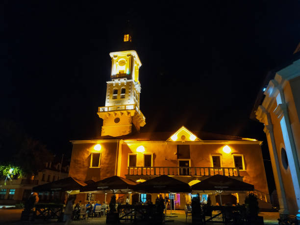 Kamianets-Podilskyi, Ukraine - August, 2020: City Hall or Town Hall, also known as Ratusha. Located on Polish Market Square in the Old Town. Historic part of Kamianets-Podilskyi in Ukraine at night