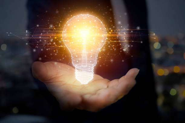 istock Businessman with illuminated light bulb concept for idea 1374377778