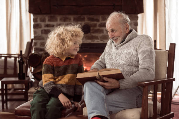 Grandfather telling a funny story stock photo