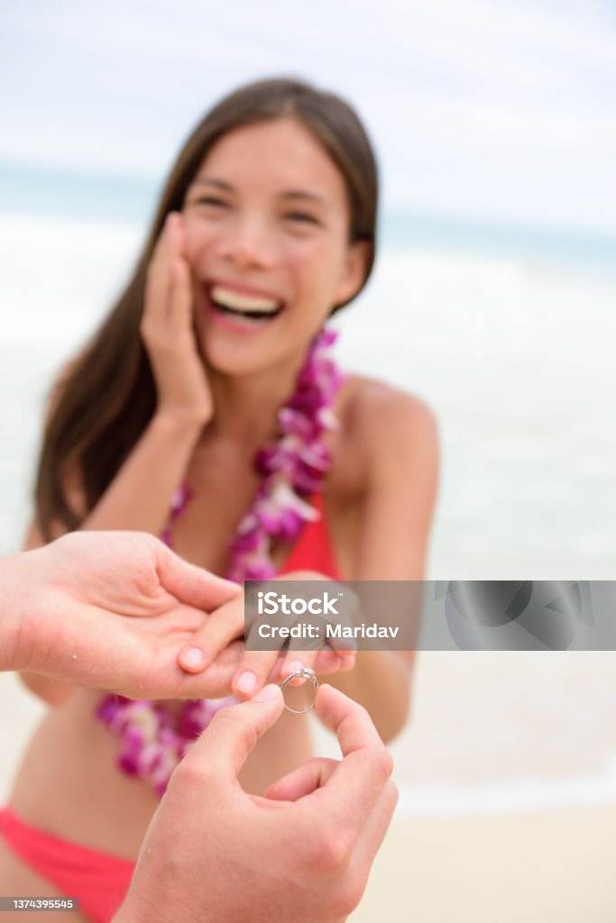Marriage proposal casual couple beach wedding Marriage proposal casual couple beach wedding concept. Man proposing to girlfriend during holiday travel. Young lovers in love. Girlfriend Stock Photo