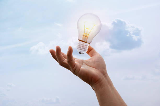 istock lightbulb on hand black background,abstract enegy magic concept 1374398123