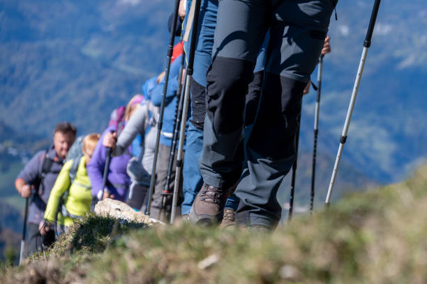istock Group of hikers walking on dirt track 1374414777