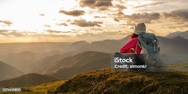 Woman Sitting On Top Of Mountain Stock Photo - Download Image Now - Hiking, One Woman Only, Contemplation