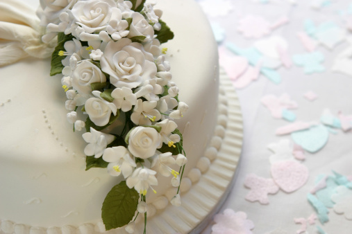 Close up of wedding cake with sugarpaste flowers and confettihttps://dl.dropbox.com/u/67702026/love%2Cwedding%20and%20valentine%20banner.jpg