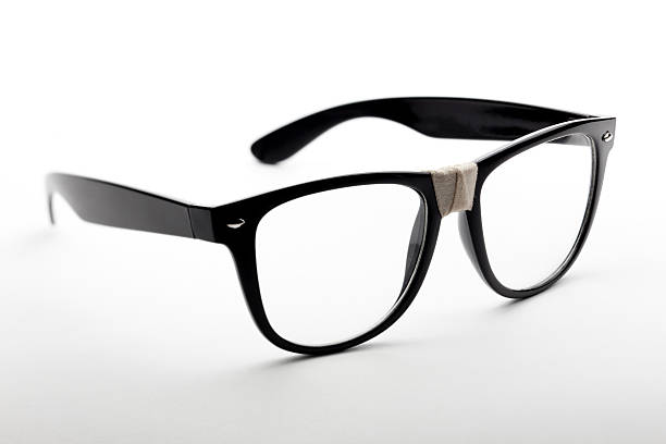 istock Black glasses with tape on the nosepiece 137442053