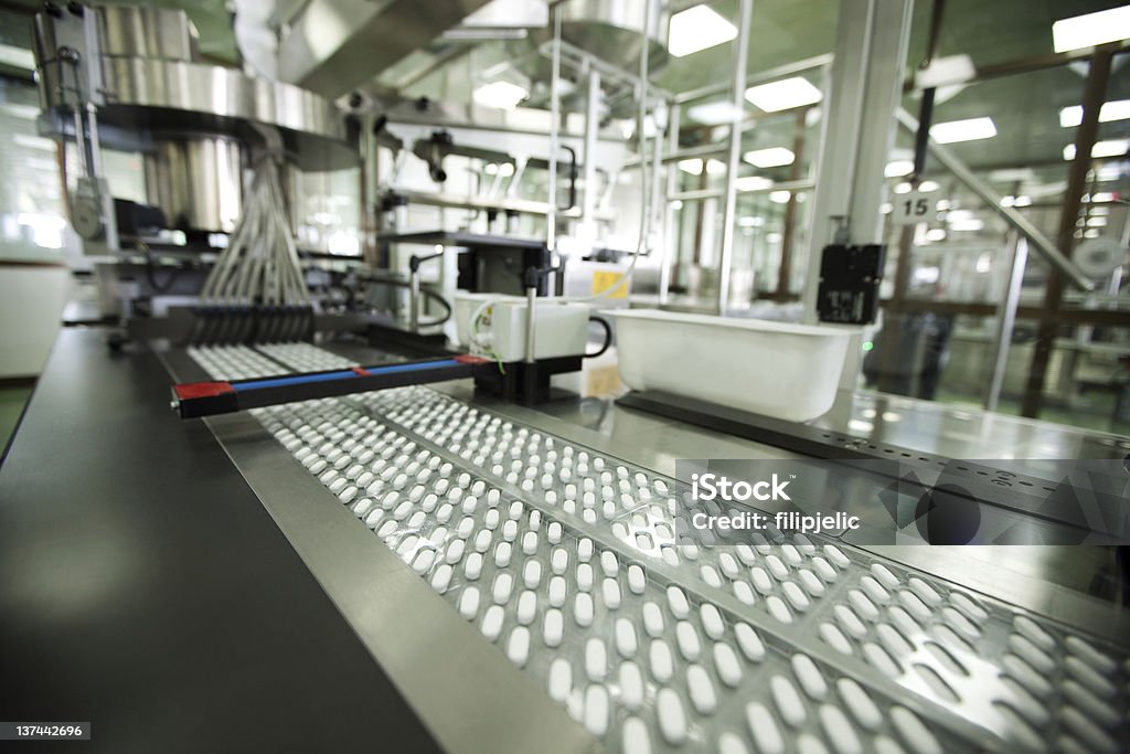 tablet packing in pharmaceutical company pills being packed in blisters on production line in a pharmaceutical company Medicine Stock Photo