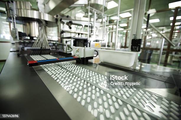 Tablet Packing In Pharmaceutical Company Stock Photo - Download Image Now - Medicine, Pharmaceutical Factory, Machinery