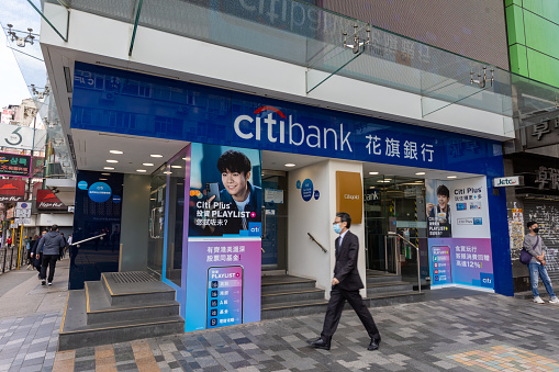 Hong Kong - February 28, 2022 : People walk past the Citibank in Tsim Sha Tsui, Hong Kong.