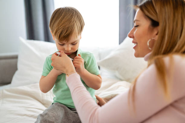 istock Mother checking temperature of her sick child 1374452022