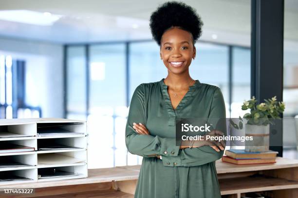 Shot Of A Young Businesswoman Standing In An Office At Work Stock Photo - Download Image Now
