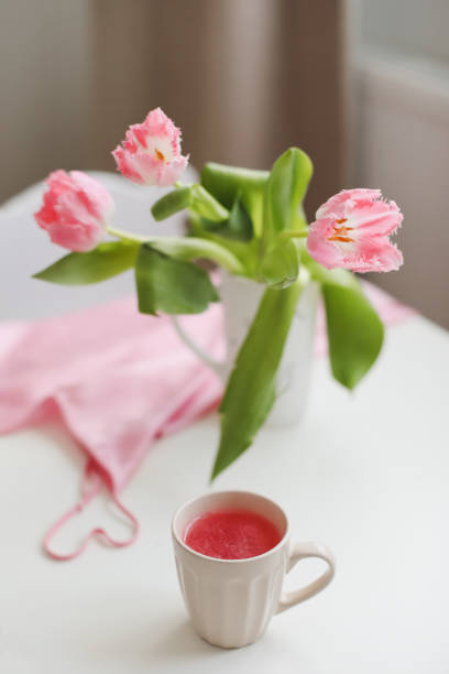 istock spring still life with fresh pink tulips, home decor. 1374454403