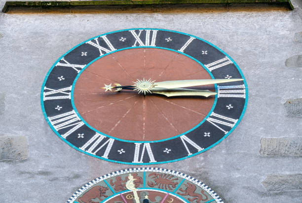 istock An ancient clock with Romans number with a partly visible mechanism of other clock beyound it 1374454595