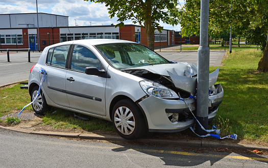 St Neots, Cambridgeshire, England - July 04, 2020: Car crashed into lamp post near car park exit.