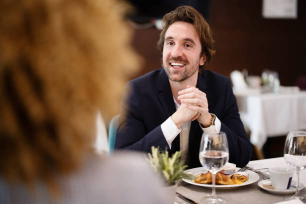 istock Businessman having brunch with  colleague at hotel. 1374458098