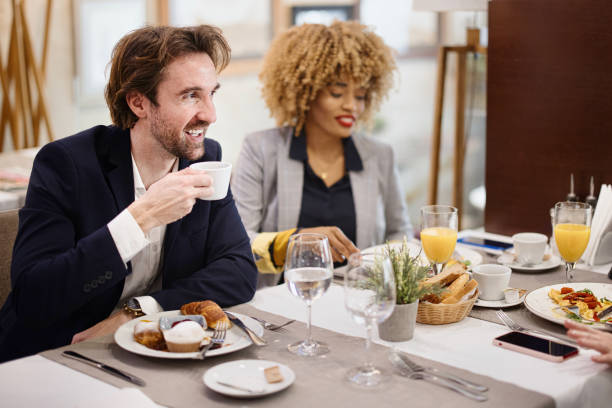 istock Business People Having a Meal at a Hotel Restaurant 1374459242