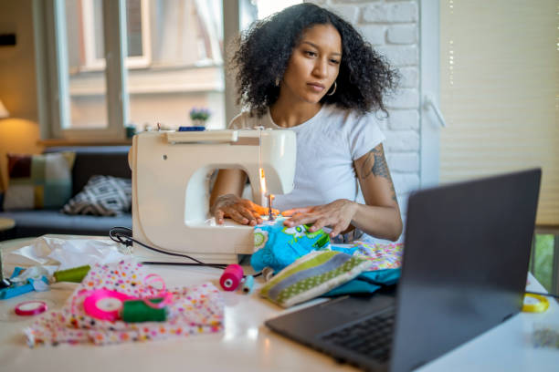 istock Woman running a sewing from home business 1374470747