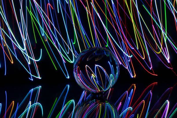 istock light painting with crystal ball, colored lights, light trails, abstract photos 1374470850