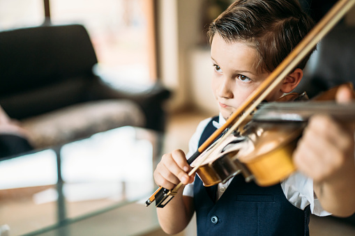 Small boy playing violin