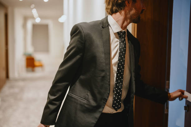 istock Businessman entering the hotel room 1374474592