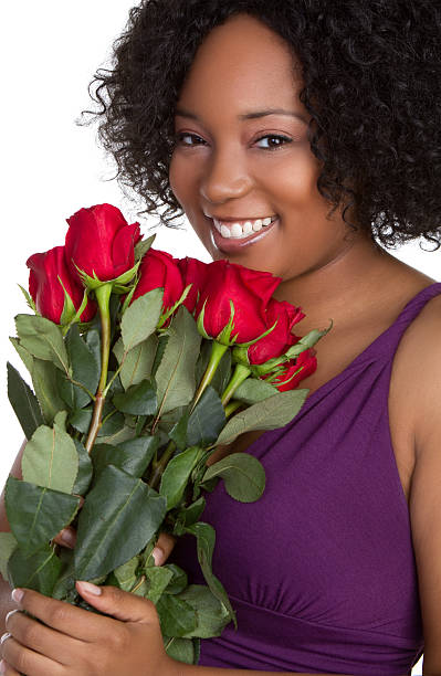 Woman Holding Roses Black woman holding red roses dozen roses stock pictures, royalty-free photos & images