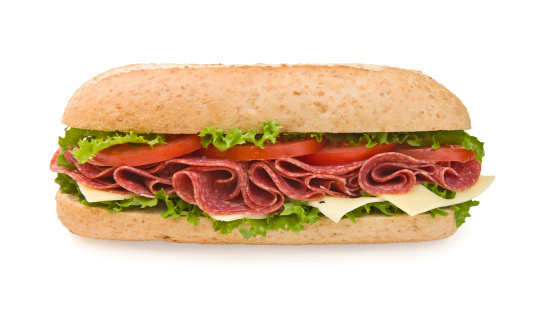 Multi-grain salami sandwich with lettuce, cheese and tomatoes