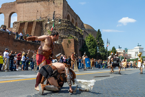 Rome, Italy,  April 17, 2011: People dressed as gladiators reenacting the Ancient Rome life, on April 17, 2011 in Rome, Italy. Reenactment of ancient Rome with gladiators and Caesars, known as “Natale di Roma”