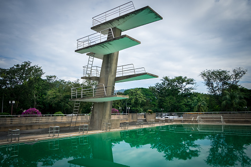 View of diving board on the blue sky in Thailand. This photo can be used for sport concept.