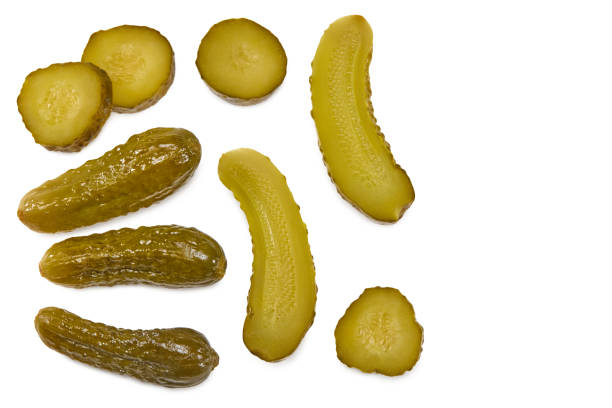 istock marinated pickled cucumbers with slices isolated on white background. Clipping path and full depth of field. Top view 1374503438
