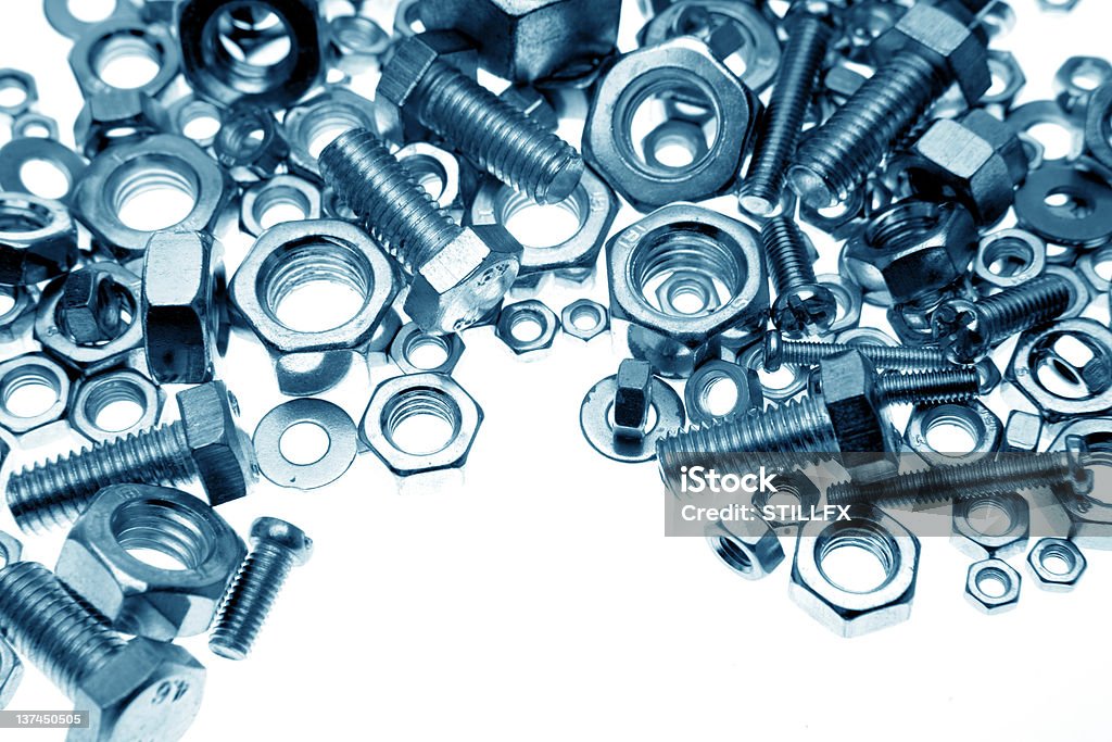 Nuts and bolts Chrome nuts and bolts close-up Blue Stock Photo