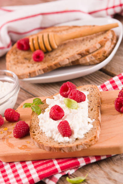 istock Rye bread with cottage cheese and raspberries. 1374511572
