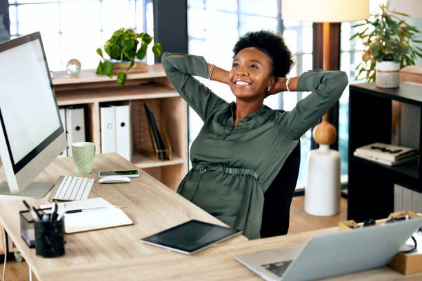 istock shot of a young businesswoman relaxing while at work 1374518328