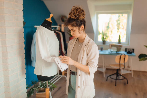 istock Young fashion designer working in her atelier 1374529512
