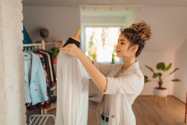 istock Young fashion designer working in her atelier 1374531063