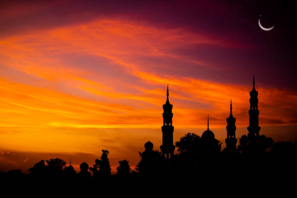 Ramadan, Eid ai-fitr,New year Muharram islamic Ramadan, Eid ai-fitr,New year Muharram islamic religion Symbols with Mosques Dome silhouette on dark gold twilight sky in night with Crescent Moon on sunset. arabic,Eid al-adha,mubarak  Muslim concept islam moon stock pictures, royalty-free photos & images