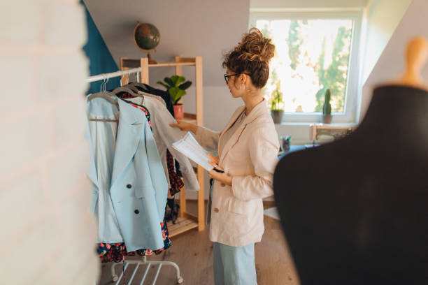 istock Young fashion designer working in her atelier 1374540186