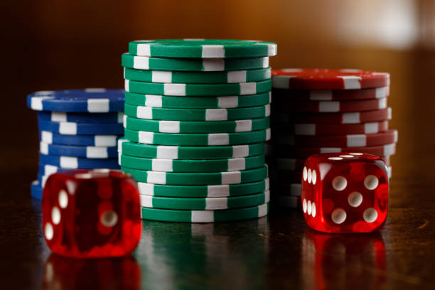 istock Group of gambling chips and red dice 1374544921