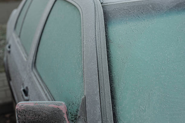 istock Car covered with ice and icicles after freezing rain. ice storm 1374544955