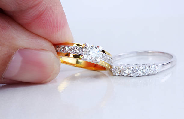 istock Hand pick golden ring with diamond and contemporary diamondring 137454619