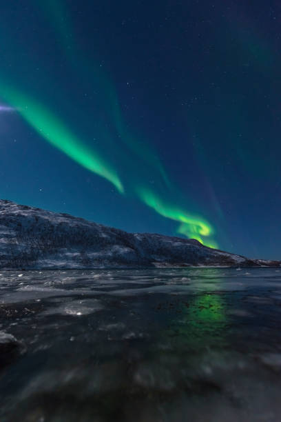 istock Aurora Northern Polar light in night sky over Northern Norway 1374560596