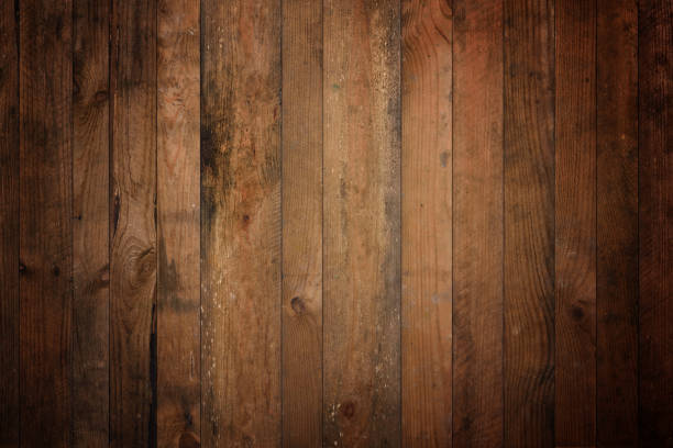 istock Dark old barn wood background texture. Vintage weathered rough planks 1374570537