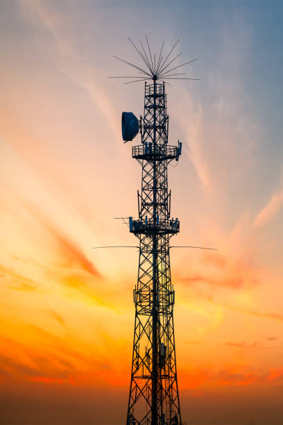 istock 5G Sunset Cell Tower: Cellular communications tower for mobile phone and video data transmission 1374571076