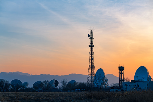 5G Sunset Cell Tower: Cellular communications tower for mobile phone and video data transmission