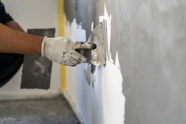 close up of human hands working on concrete wall texture - plaster imagens e fotografias de stock