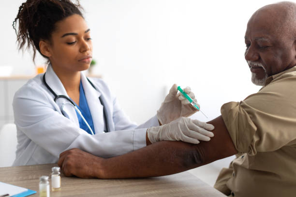 istock Senior Patient Getting Vaccinated Sitting In Medical Center 1374579248