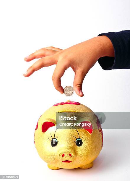 Hand Putting Money Into Saving Pig Stock Photo - Download Image Now - Coin, Coin Bank, Currency