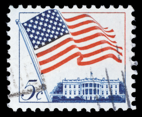 Image of USA flag and Yosemite National Park Stamp with black background.
