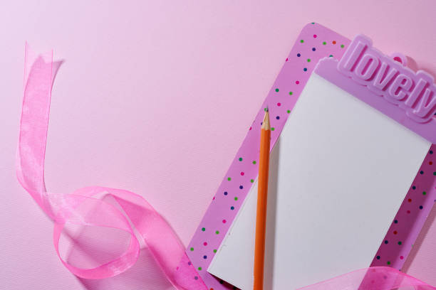 pink lovely clipboard against pink background