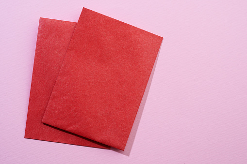 blank red red envelope on pink background