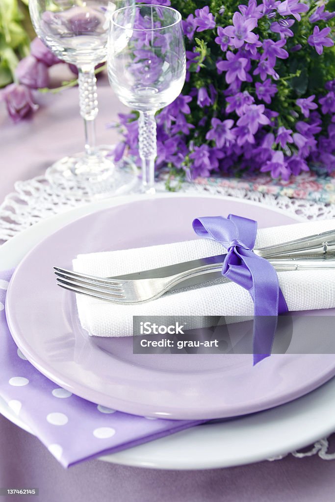 Table setting in purple color Table setting in purple color with Dishware Celebration Stock Photo