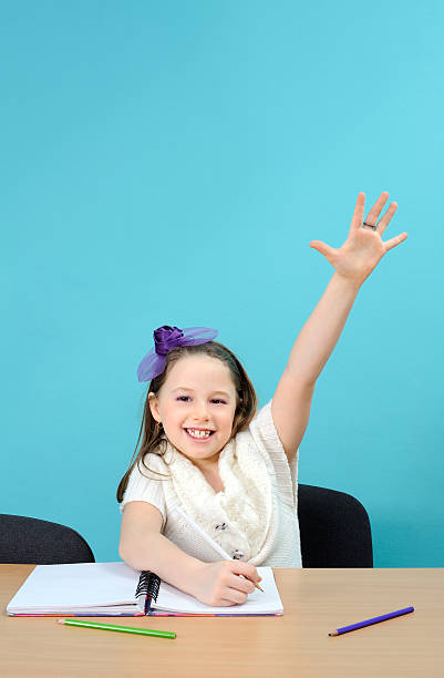 istock Happy schoolgirl doing her school work 137462494